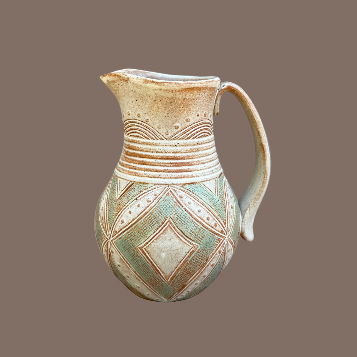 Small Carved Pitcher