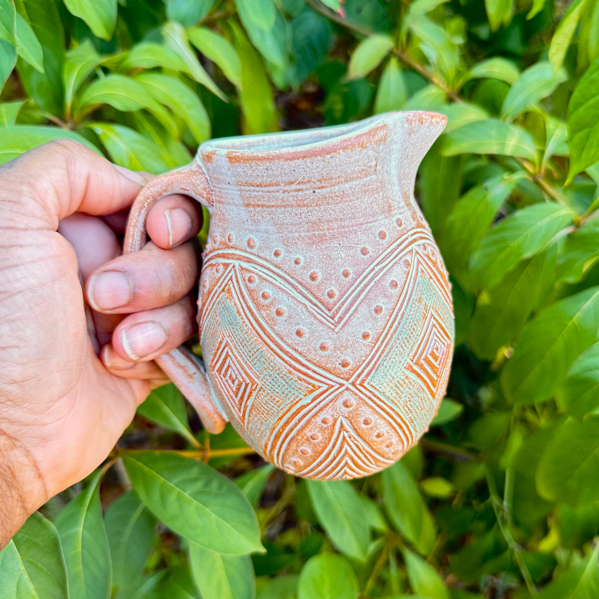 Small Carved Pitcher